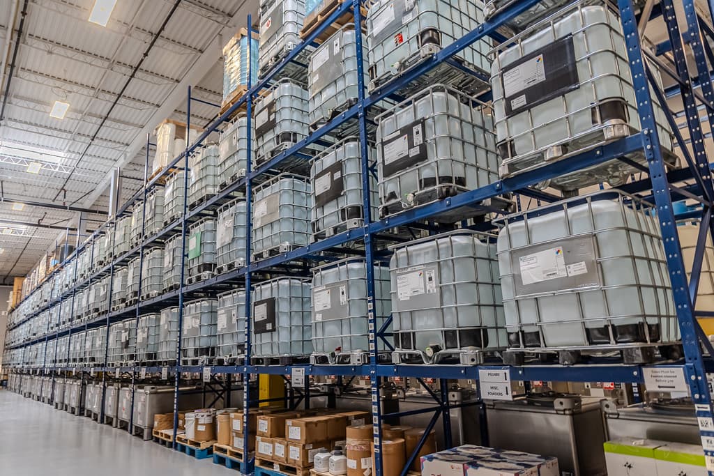 Liquid flavor totes staged in the warehouse